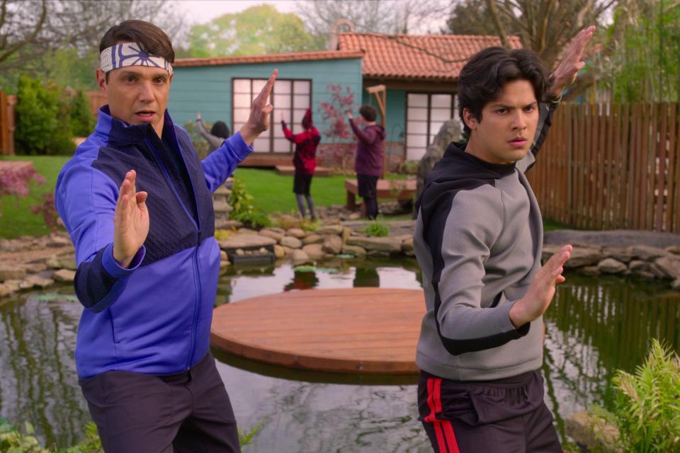 Daniel LaRusso (Ralph Macchio, left) teaches the ways of Mr. Miyagi to Miguel Diaz (Xolo Maridueña) in "Cobra Kai."