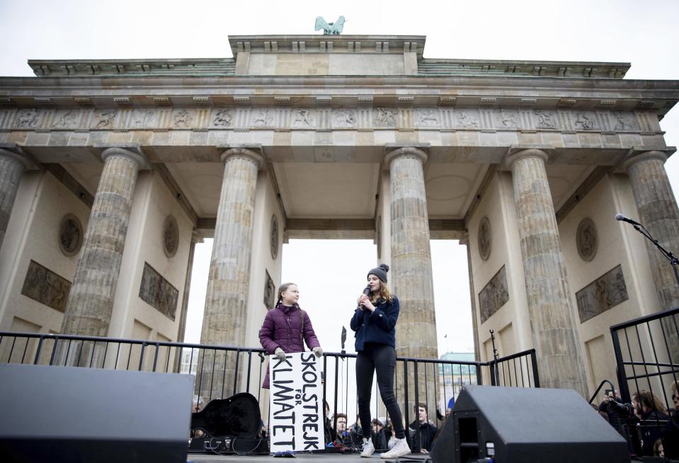 Swedish climate activist Greta Thunberg attends the 'Friday For Future' rally at the "Brandenburg Gate" in Berlin, Germany, Friday, March 29, 2019. Thousands of students are gathering in the German capital, skipping school to take part in a rally demanding action against climate change. (Kay Nietfeld/dpa via AP)