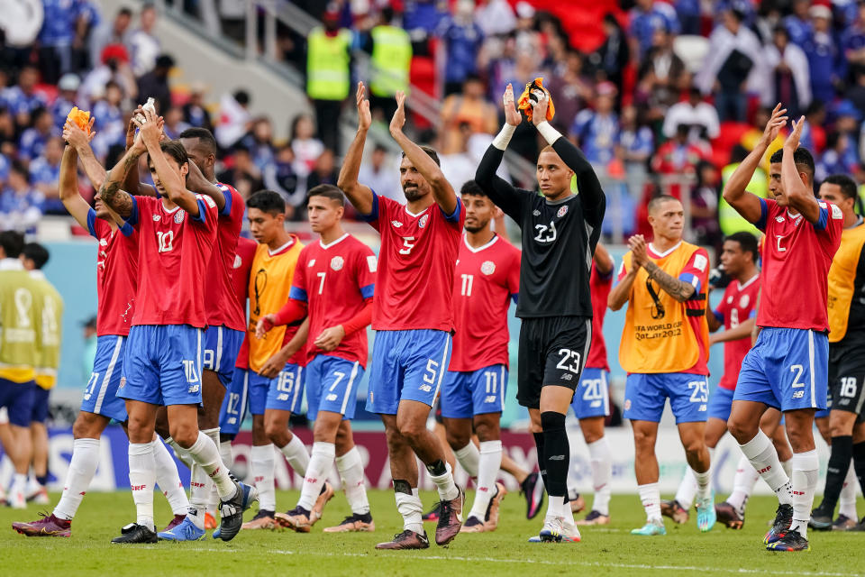 DOHA, QATAR - NOVEMBER 27: Costa Rica celebrate after winning the FIFA World Cup Qatar 2022 Group E match between Japan and Costa Rica at Ahmad Bin Ali Stadium on November 27, 2022 in Doha, Qatar. (Photo by Mohammad Karamali/DeFodi Images via Getty Images)