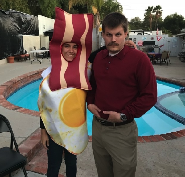 Someone dressed as bacon and eggs, and another dressed in Ron Swanson's red shirt and mustache