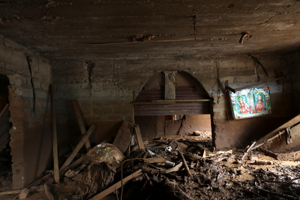 <p>A wall painting is seen on a wall of a room filled with debris and mud after a flash flood at Pentagon, in Freetown, Sierra Leone Aug. 18, 2017. (Photo: Afolabi Sotunde/Reuters) </p>