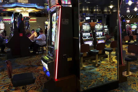 People play slot machines inside a casino in Atlantic City, New Jersey, January 19, 2016. REUTERS/Shannon Stapleton