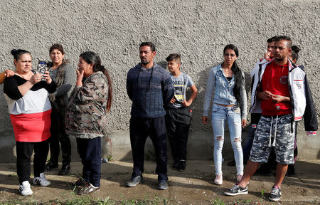 Roma people gather on the outskirts of the town to commemorate the killings of Roma people by right-wing militants in 2009, in Torokszentmiklos, Hungary, May 21, 2019. REUTERS/Bernadett Szabo