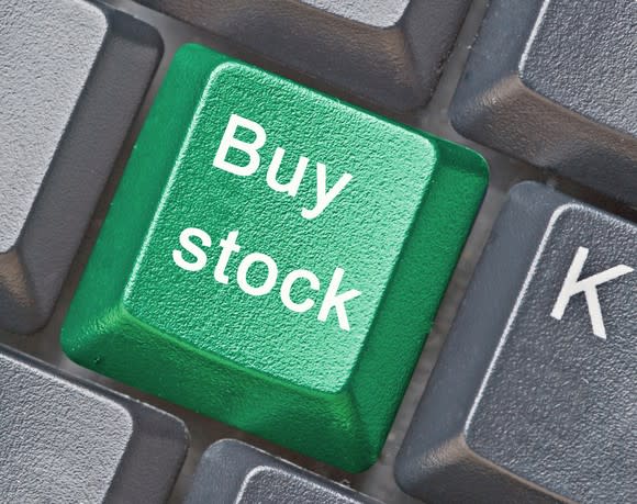 A green keyboard button -- among gray buttons -- that says buy stock.