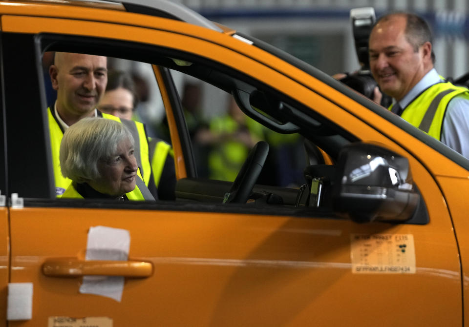 U.S. Treasury Secretary Janet Yellen looks into the interior of newly build vehicle during her tour at the Ford Assembling Plant in Pretoria, South Africa, Thursday, Jan. 26, 2023. (AP Photo/Themba Hadebe)