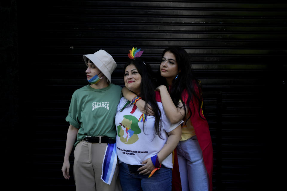 Claudia Delfín of Bolivia poses for a picture with her trans boy Zan, and her bisexual daughter Celeste, in Buenos Aires, Argentina, Saturday, Nov. 5, 2022. Delfín, who is from the Bolivian city of Santa Cruz de la Sierra, tried to seek help in government offices for her two trans children who were facing bullying and discrimination in their school when they were 16. “They told me to go to church and look for a better path, they practically sent me to pray,” Delfín said, saying she then felt targeted by the same people who were supposed to assist her and her children. (AP Photo/Natacha Pisarenko)