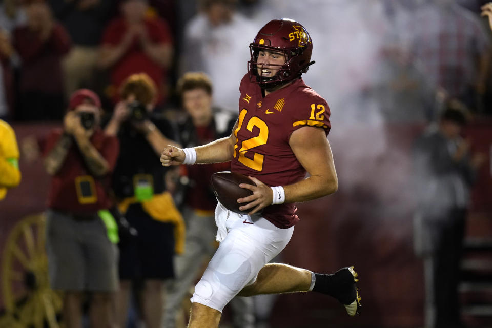 Iowa State quarterback Hunter Dekkers (12) scores on a 41-yard touchdown run during the second half of an NCAA college football game against Kansas, Saturday, Oct. 2, 2021, in Ames, Iowa. (AP Photo/Charlie Neibergall)