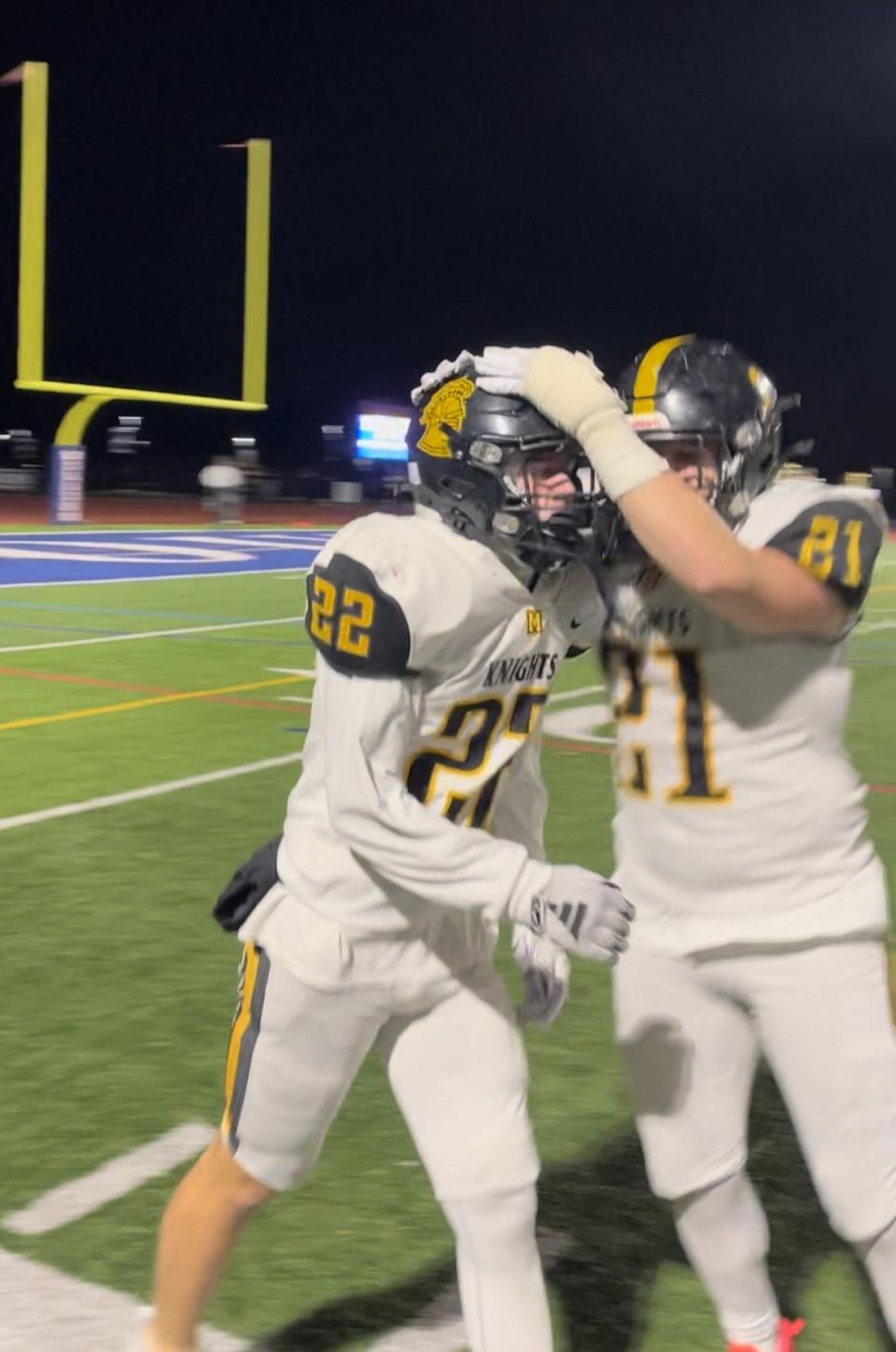 McQuaid's Dan Geen (22) celebrates his go-ahead touchdown with Zach Couch during the NYSPHSAA Class AA region final Saturday, Nov. 18, 2023 at Williamsville South High School. The Knights would lose to reigning state champion Bennett 26-21 on a last-second touchdown.