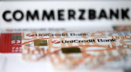 A 3-D printed Commerzbank logo is seen near Unicredit credit cards in this illustration taken September 20, 2017. REUTERS/Dado Ruvic/Illustration