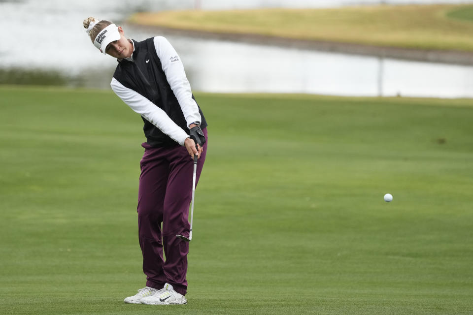 Nelly Korda chips on the green at the 18th hole during the final round of LPGA Ford Championship golf tournament Sunday, March 31, 2024, in Gilbert, Ariz. (AP Photo/Ross D. Franklin)