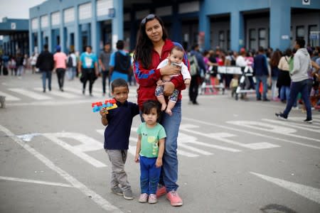 The Wider Image: Venezuelan mothers, children in tow, rush to migrate