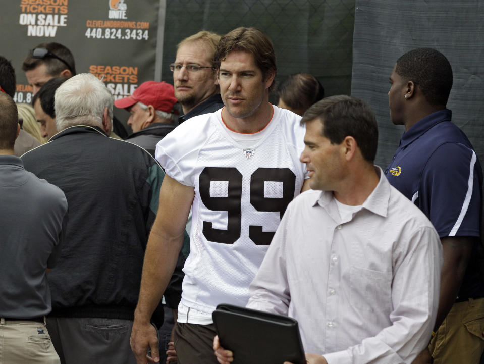 Cleveland Browns linebacker Scott Fujita (99) leaves a media interview following NFL football practice at the team's headquarters in Berea, Ohio Tuesday, May 22, 2012. (AP Photo/Mark Duncan)