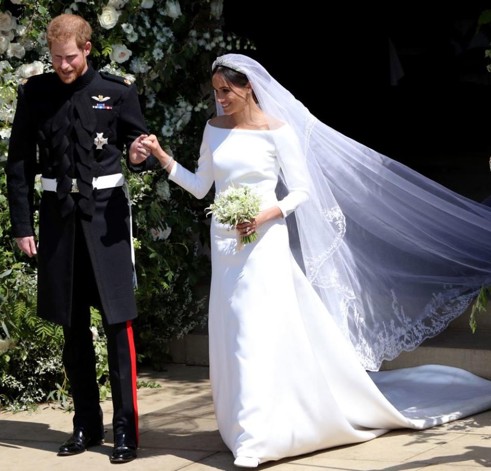 <p>For her big day Meghan wore a beautiful yet simple <a href="https://www.cosmopolitan.com/uk/fashion/celebrity/a20059158/meghan-markle-wedding-dress/" rel="nofollow noopener" target="_blank" data-ylk="slk:Givenchy gown;elm:context_link;itc:0;sec:content-canvas" class="link ">Givenchy gown</a> but turned up the drama with her <a href="https://www.cosmopolitan.com/uk/fashion/celebrity/a20755137/meghan-markle-royal-wedding-veil-secret-meaning/" rel="nofollow noopener" target="_blank" data-ylk="slk:dramatic 16.5ft veil;elm:context_link;itc:0;sec:content-canvas" class="link ">dramatic 16.5ft veil</a> and <a href="https://www.cosmopolitan.com/uk/fashion/celebrity/a20756085/royal-wedding-meghan-markle-tiara/" rel="nofollow noopener" target="_blank" data-ylk="slk:tiara;elm:context_link;itc:0;sec:content-canvas" class="link ">tiara</a>, which previously belonged to the Queen's grandmother, Queen Mary. </p>