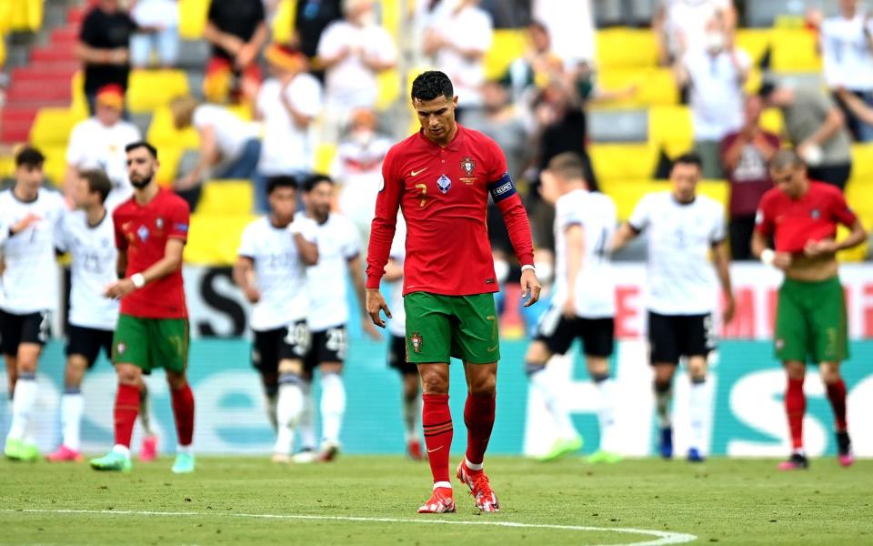 Cristiano Ronaldo looks dejected after Germany score an equaliser during their Group F game in Munich