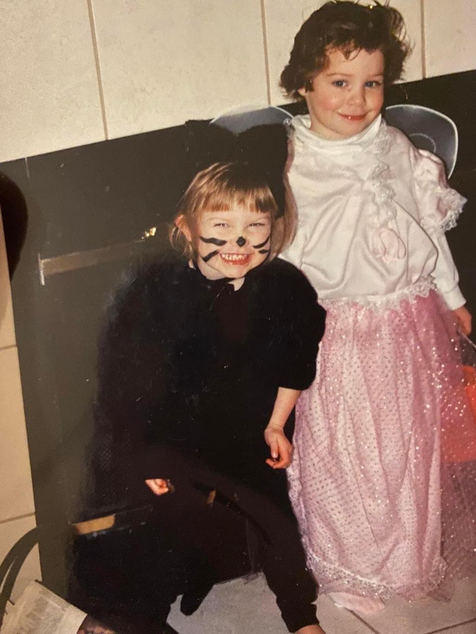 Lana Hiott, left, and her sister Shannon as children dressed up for Halloween. Shannon Hiott died Aug. 29 after being stabbed to death in her home. Police have charged her ex-boyfriend with her death.