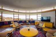<p>Talk about a room with a view! With panoramic vistas of the Palm canyon below and midcentury furniture, this living area feels like you stepped into another, very glamorous decade.</p>