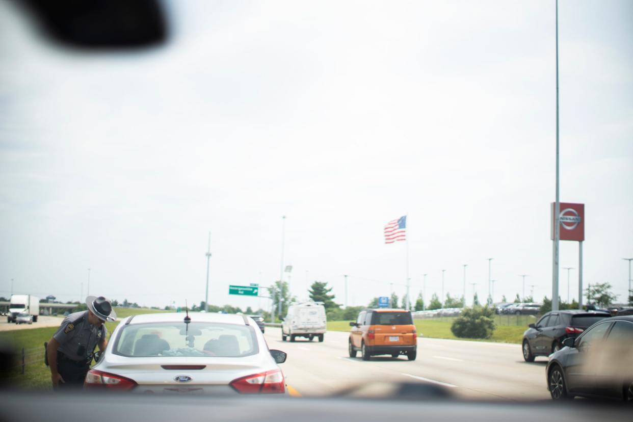 State Highway Patrol trooper Bill Duerson, talks to someone he caught speeding during their zero-tolerance speeding and reckless driving enforcement day.