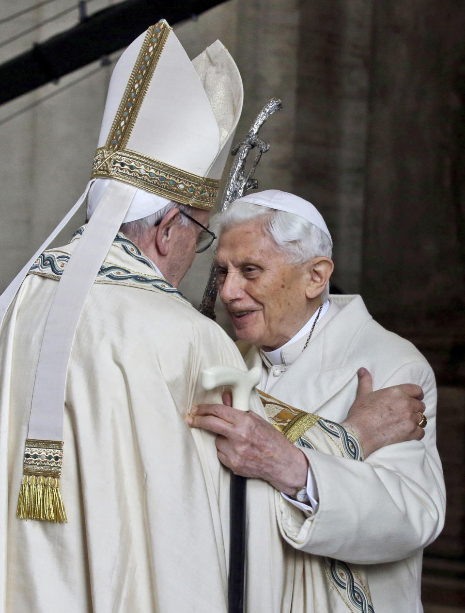 FILE - In this Dec. 8, 2015 file photo, Emeritus Pope Benedict XVI, right, hugs Pope Francis inside St. Peter's Basilica during the ceremony marking the start of the Holy Year, at the Vatican. Emeritus Pope Benedict XVI has marked the eighth anniversary of his historic resignation by insisting in an interview published in Corriere della Sera Monday, March 1, 2021, that he stepped down knowingly and that “there is only one pope” _ Francis. (AP Photo/Gregorio Borgia, file)