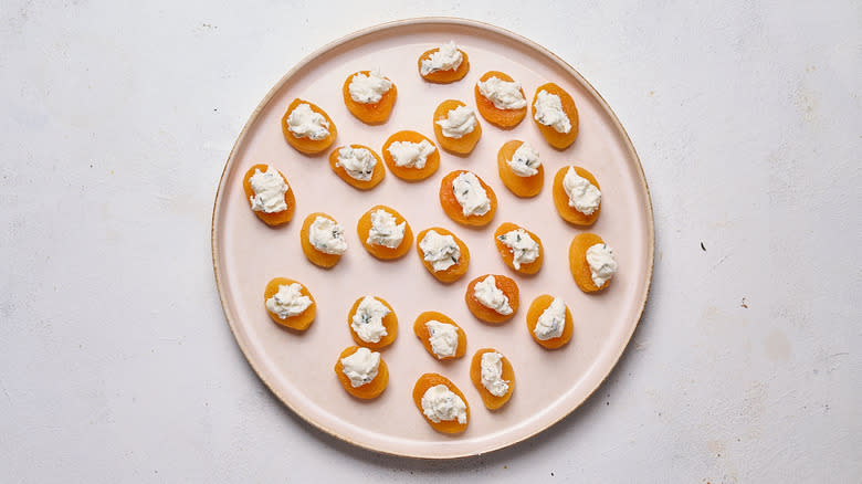 apricots and goat cheese on plate