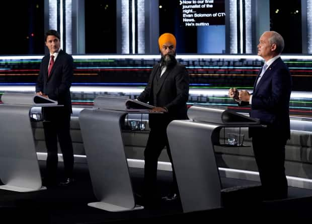 Liberal Leader Justin Trudeau, left, NDP Leader Jagmeet Singh, centre, and Conservative Leader Erin O'Toole all believe their parties could pick up seats in the areas in and around Vancouver on election night.  (Adrian Wyld/The Canadian Press - image credit)