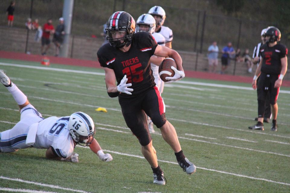 ADM's Brevin Doll runs the ball down the field against Lewis Central on Sept. 8, 2023, at Tiger Stadium in Adel.