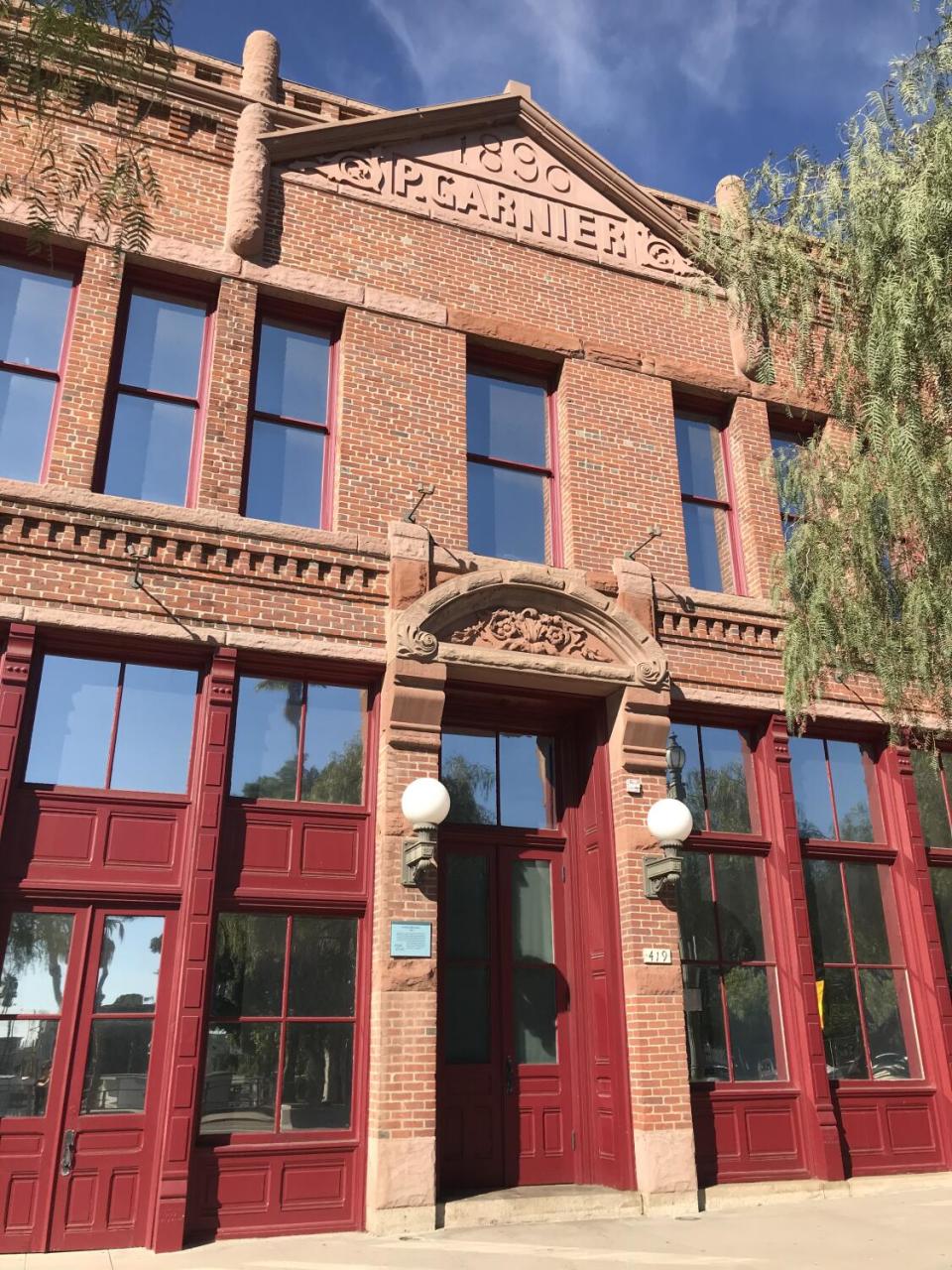 A view of the red brick facade of the Garnier Building