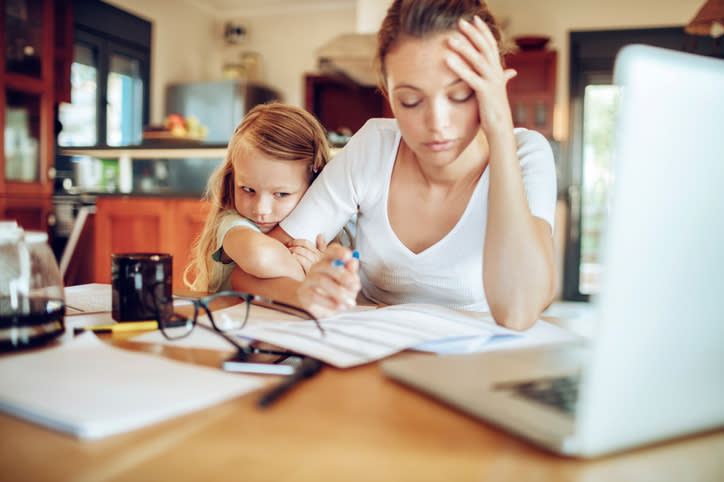 Close up of a mother going through her financials