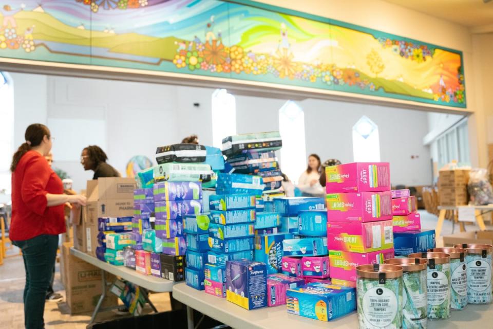 Moon Time Connections at a packing party, where menstrual products are being packaged for distribution to the North. 