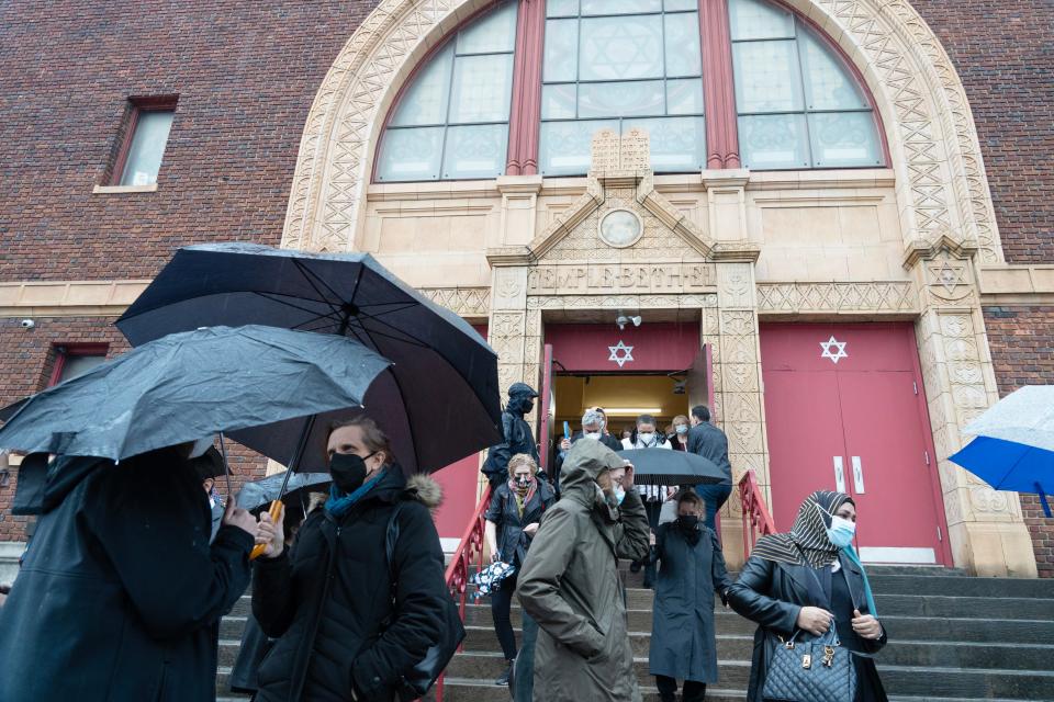 Mourners leave from the funeral of Alain Mentha, a Jersey City resident who founded a refugee support agency, Welcome Home Jersey City. The funeral was held at Temple Beth El in Jersey City, N.J. on Tuesday Jan. 3, 2023.