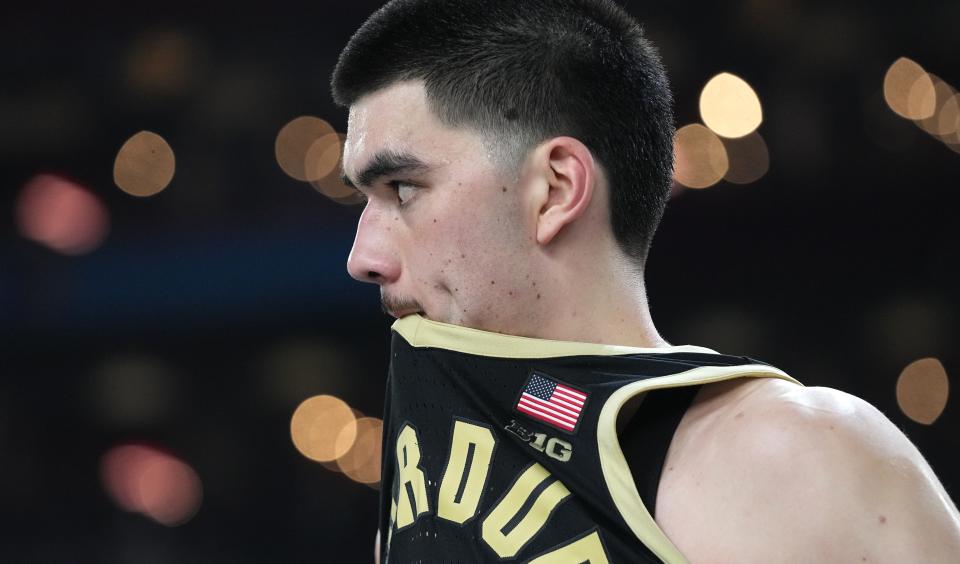 Purdue's Zach Edey bites onto his jersey after the Boilermakers' loss to Connecticut in the men's NCAA Tournament championship game.