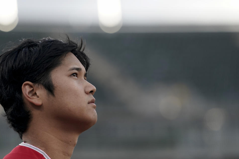 Los Angeles Angels' Shohei Ohtani listens to the national anthem before the team's baseball game against the Oakland Athletics Friday, Sept. 1, 2023, in Oakland, Calif. (AP Photo/Godofredo A. Vásquez)