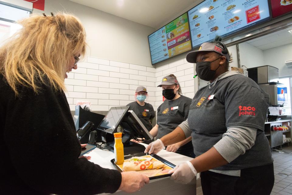 Orders are served fresh Tuesday at the Taco John's inside the new Kwik Shop at 3706 S.W. Burlingame Road during an employee simulation training. The restaurant is slated to open Wednesday with options of dine-in, carryout and drive-through.