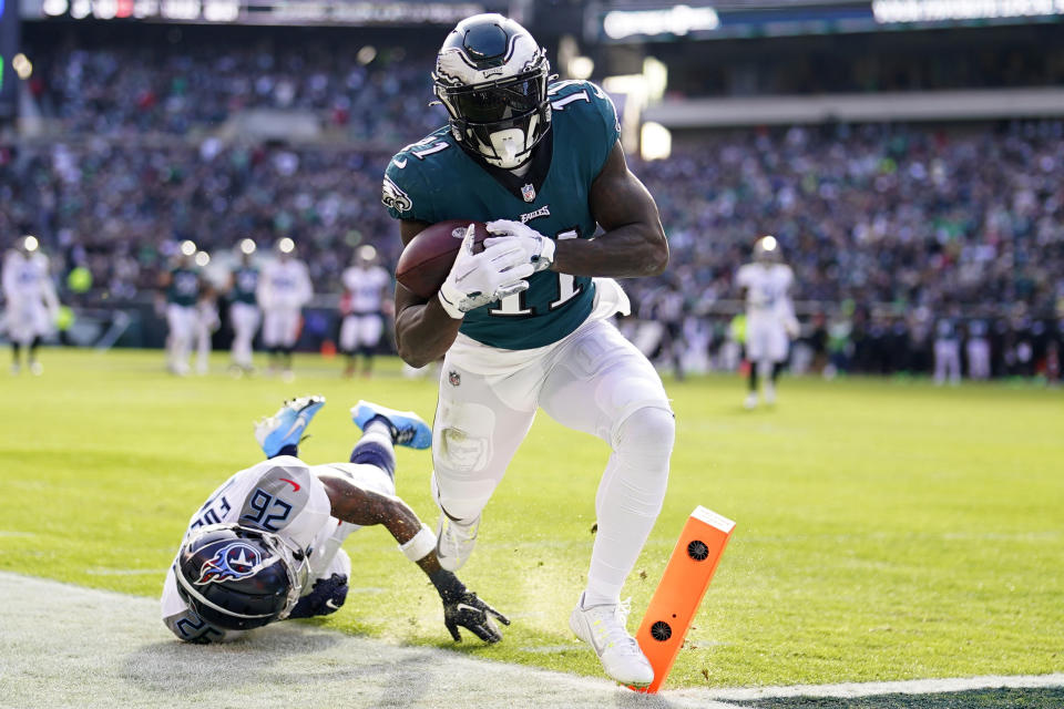 Philadelphia Eagles' A.J. Brown scores a touchdown in front of Tennessee Titans' Kristian Fulton during the first half of an NFL football game, Sunday, Dec. 4, 2022, in Philadelphia. (AP Photo/Matt Rourke)