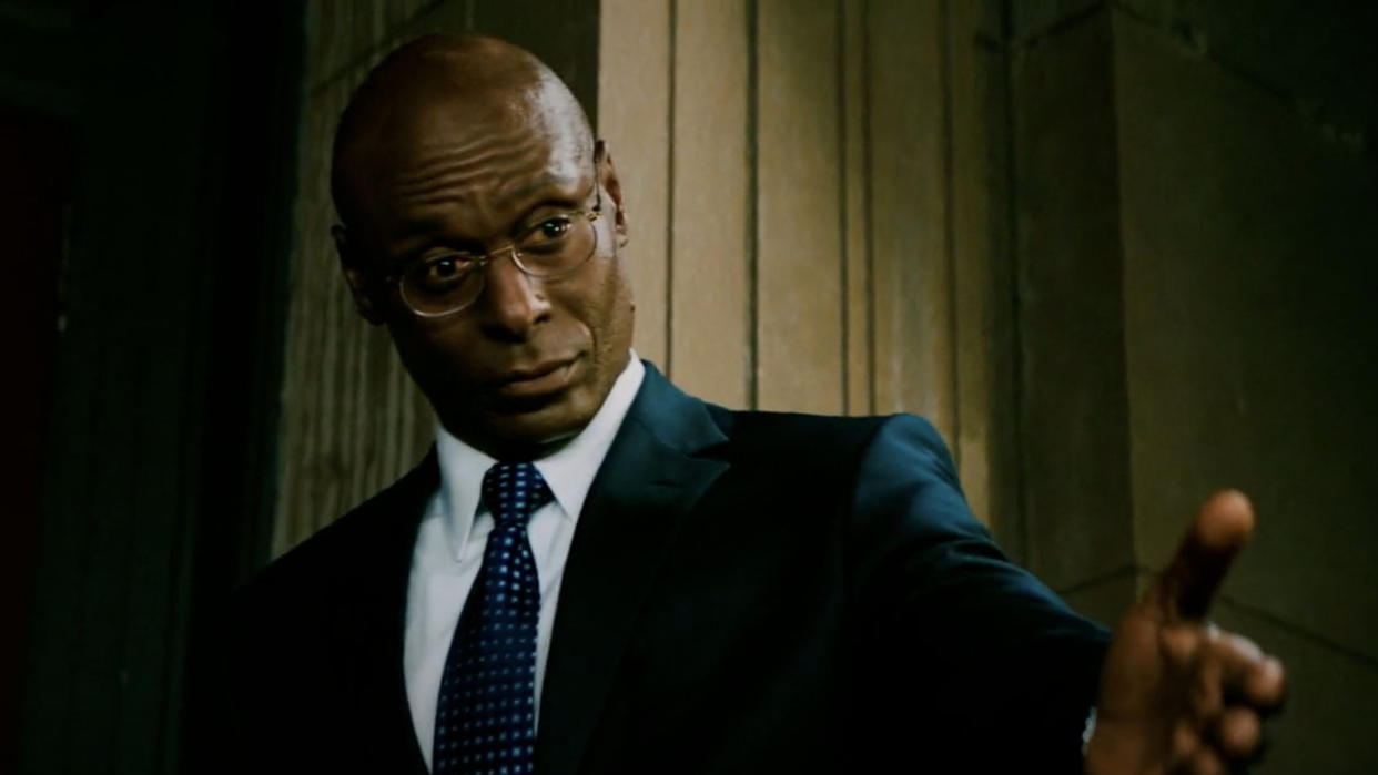  Lance Reddick welcoming a guest into The Continental in John Wick: Chapter 3 - Parabellum. 