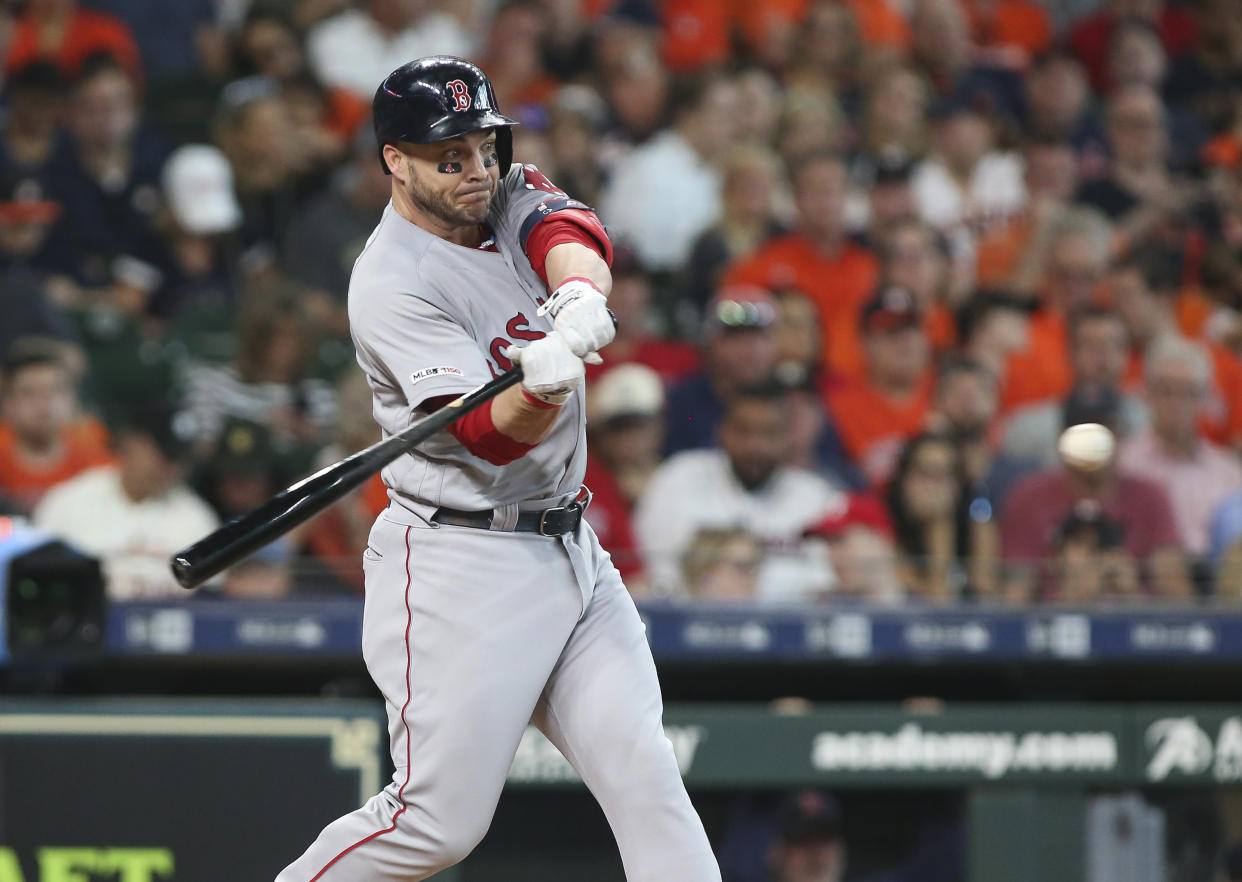 May 26, 2019; Houston, TX, USA; Boston Red Sox first baseman Steve Pearce (25) hits an infield single during the third inning against the Houston Astros at Minute Maid Park. Mandatory Credit: Troy Taormina-USA TODAY Sports