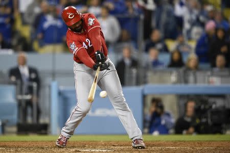 Apr 15, 2019; Los Angeles, CA, USA; Cincinnati Reds left fielder Matt Kemp (27) hits an RBI infield single during the ninth inning against the Los Angeles Dodgers at Dodger Stadium. Mandatory Credit: Kelvin Kuo-USA TODAY Sports