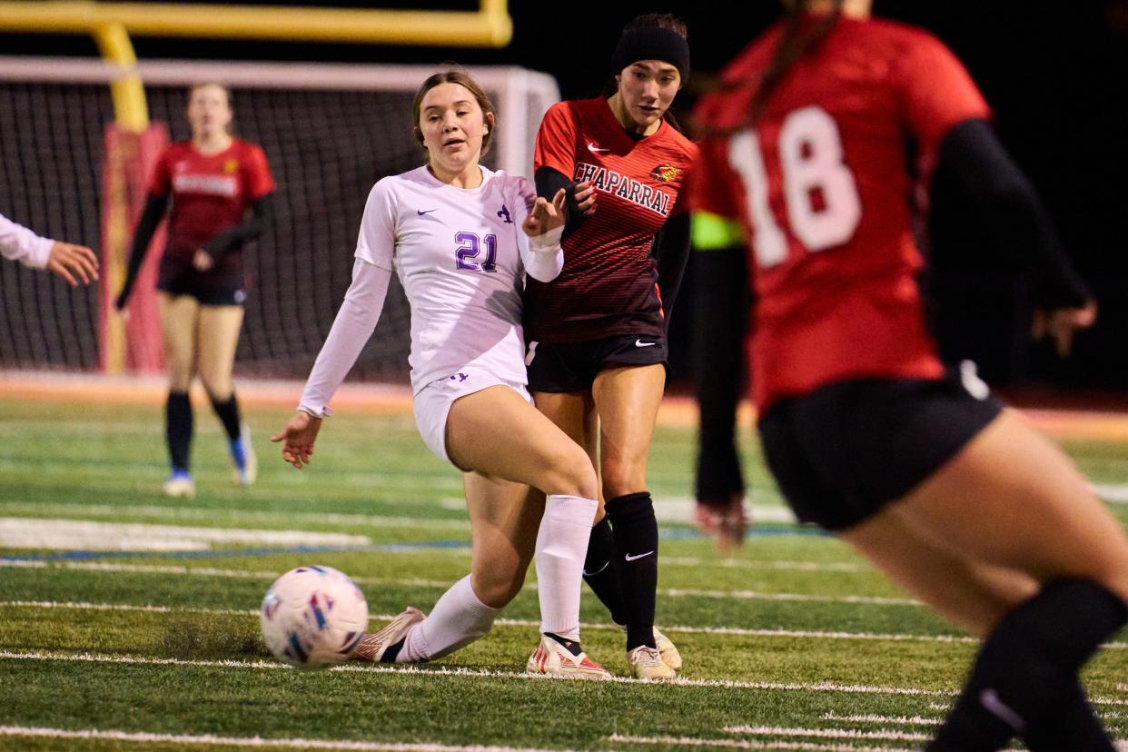 Jan 23, 2023; Scottsdale, AZ, USA; Chaparral Firebirds Marin Cohen (17) runs the ball against Notre Dame Prep Saints forward Elsa Delord (21) at Chaparral High School on Monday, Jan. 23, 2023. Mandatory Credit: Alex Gould/The Republic