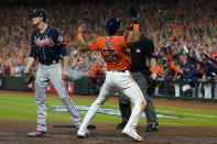 Houston Astros' Jose Siri celebrates past Atlanta Braves starting pitcher Max Fried on a throwing error during the second inning in Game 2 of baseball's World Series between the Houston Astros and the Atlanta Braves Wednesday, Oct. 27, 2021, in Houston. (AP Photo/Eric Gay)