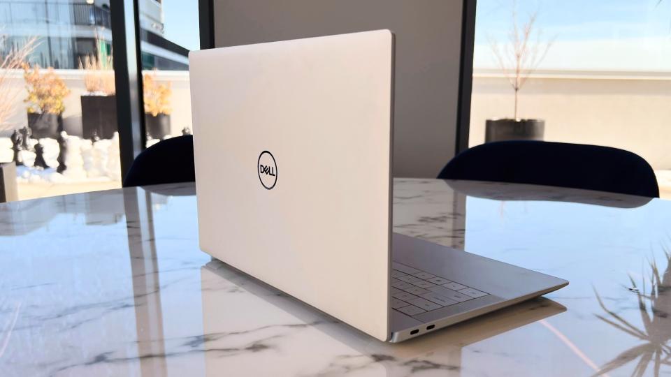 Dell XPS 14 on table showing the profile and lid