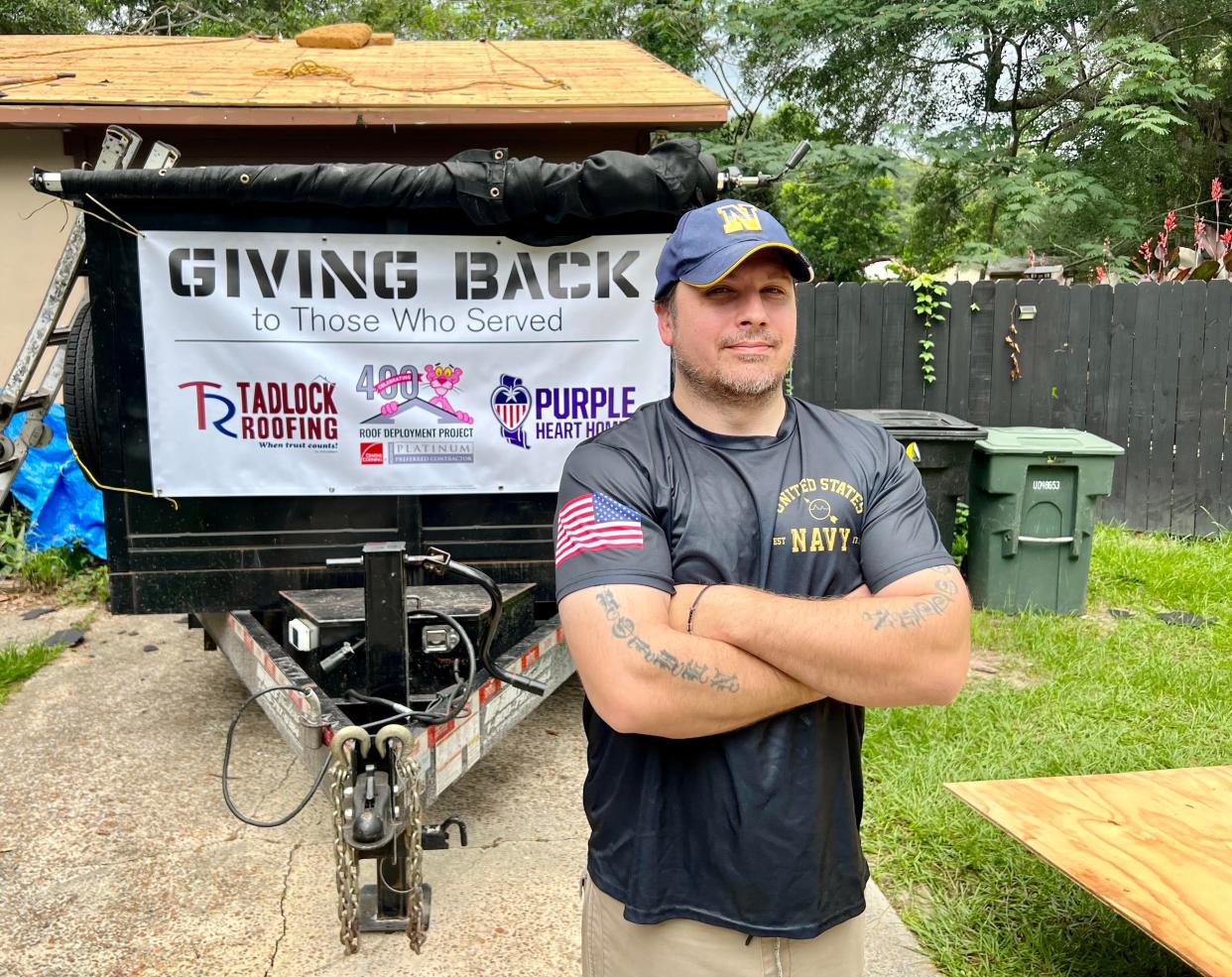 Josh Kish, a U.S. Navy veteran pictured in front of his home as he waits for his new roof installation provided by Tadlock Roofing.