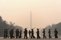 <p>With the Washington Monument in the background and a thick layer of smoke, Marine Corps honor color guard rehearse, Thursday, June 8, 2023, in Washington. Intense Canadian wildfires are blanketing the northeastern U.S. in a dystopian haze, turning the air acrid, the sky yellowish gray and prompting warnings for vulnerable populations to stay inside. (AP Photo/Jose Luis Magana)</p> 