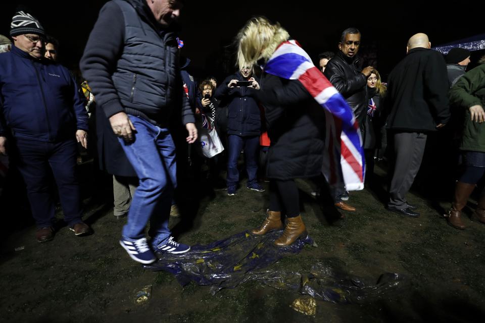 Brexit supporters trample on a European Union flag during a rally in London. (AP)