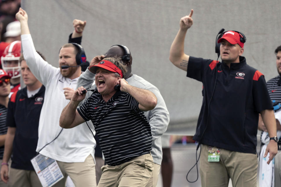 FILE - Georgia head coach Kirby Smart, center, reacts along the sideline during the first half of an NCAA college football game against Tennessee, Saturday, Nov. 5, 2022 in Athens, Ga. Georgia will begin its drive for an unprecedented college football championship three-peat as the No. 1 team in The Associated Press preseason Top 25 in the poll released Monday, Aug. 14, 2023. (AP Photo/John Bazemore, File)