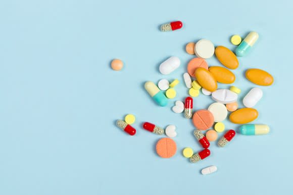 Colorful pills on a blue background.