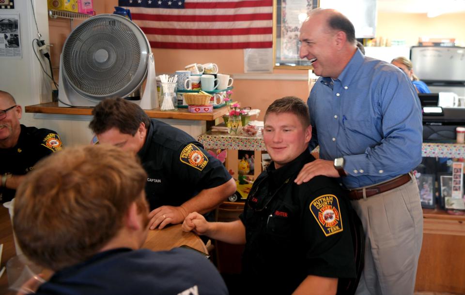 Sen. Paul Bailey jokes with members of the Putman County Fire Department at lunch at M&M Country Cafe in Cookeville on Aug. 26, 2019.