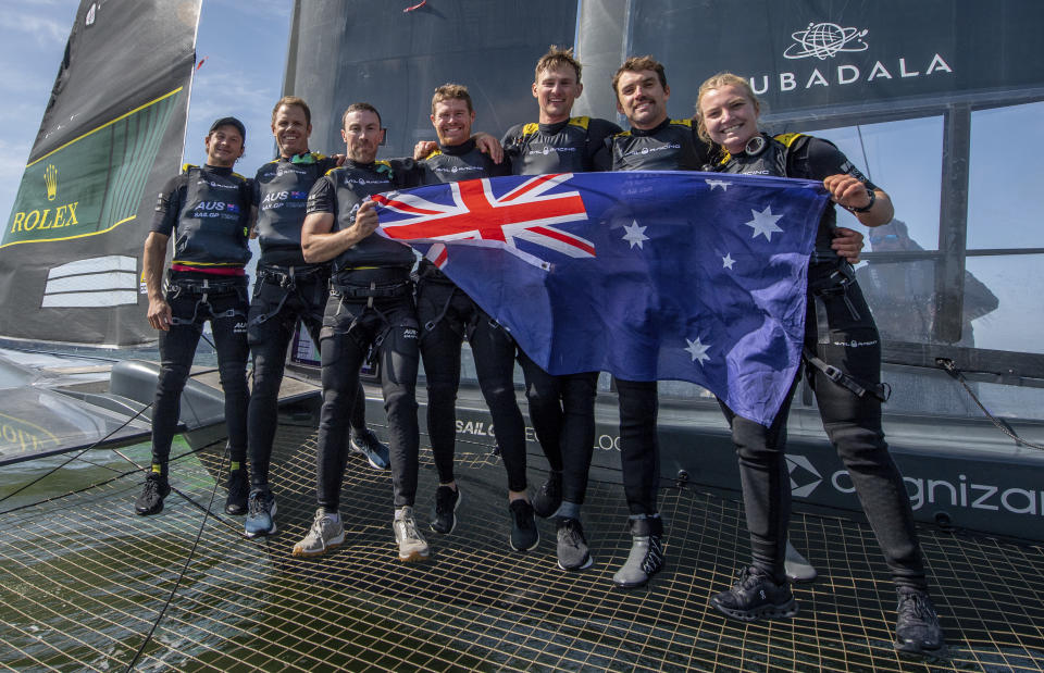 In this photo provided by SailGP, Australia SailGP Team celebrate with their national flag on board the F50 catamaran after winning the Mubadala SailGP Season 3 Grand Final and the Season 3 Championship on Race Day 2 of the Mubadala SailGP Season 3 Grand Final in San Francisco, Sunday, May, 7 2023. (Bob Martin/SailGP via AP)