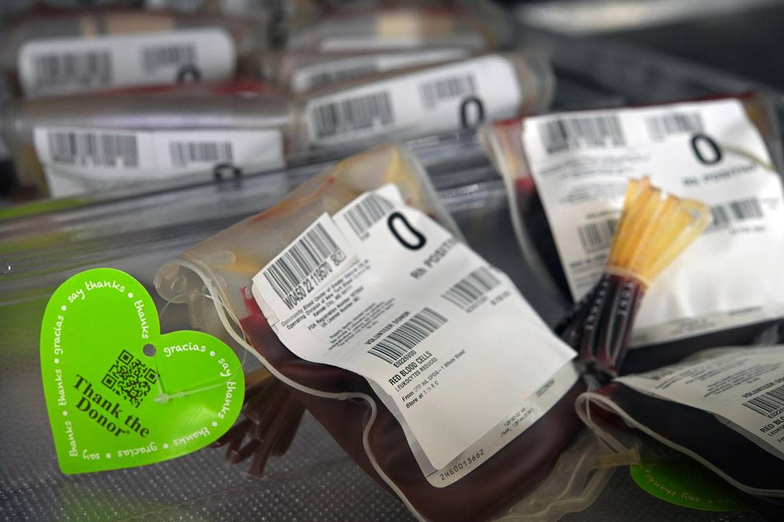 Bags of O positive blood stay refrigerated at the Community Blood Center. Recipients can scan the QR code to send a thank-you message to the donor.