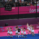 LONDON, ENGLAND - AUGUST 06: The New Zealand women's hockey team wave to supporters as they celebrate their draw with Germany during the Women's Hockey match between Germany and New Zealand on Day 10 of the London 2012 Olympic Games at Riverbank Arena Hockey Centre on August 6, 2012 in London, England. (Photo by Daniel Berehulak/Getty Images)