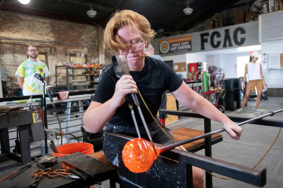 Artist Kellie Sylvester creates the last crop of glass pumpkins for the First City Art Center on Wednesday, Oct. 5, 2022. The glass works of art will be on sale at the organization's 16th annual Glass and Ceramic Pumpkin Patch on Saturday, Oct. 8, from 1 to 4 p.m. at the Blue Wahoos.