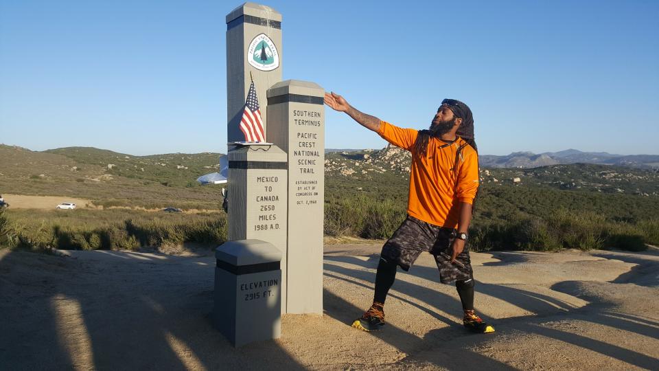 Will "Akuna" Robinson poses for a photo at the southern terminus of the Pacific Crest Trail at the Mexican border in this undated photo.